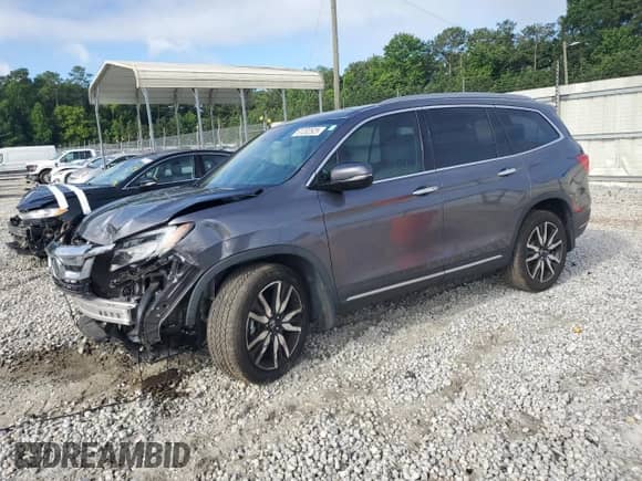 2021 Honda Pilot Touring 7-Passenger z VIN 5FNYF5H60MB024751, wystawiony jako Copart lot #61202525 z przebiegiem 56 737 mil mil oraz Szkoda całkowita • Salvage title. Historia ofert i sprzedaży dostępna na DreamBid. Obrazek 1.