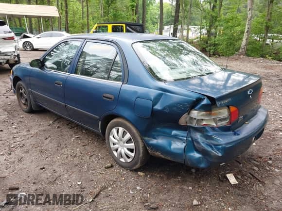 2000 Chevrolet Prizm LSi z VIN 1Y1SK5289YZ401584, wystawiony jako IAAI lot #42263210 z przebiegiem 151 567 mil mil oraz . Historia ofert i sprzedaży dostępna na DreamBid. Obrazek 3.