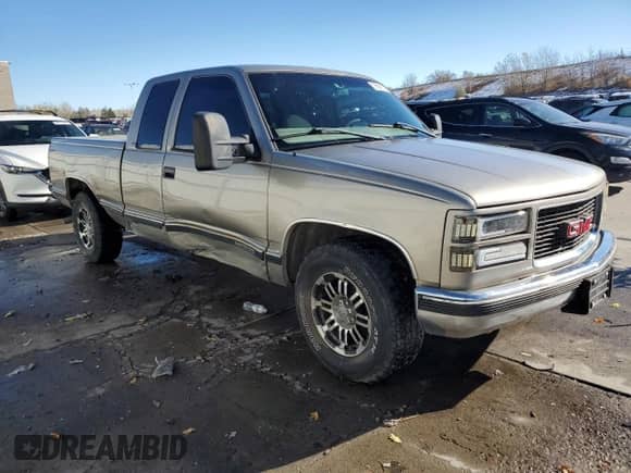 1998 GMC Sierra 1500 z VIN 1GTEC19MXWE559415, wystawiony jako Copart lot #79894184 z przebiegiem 114 711 mil mil oraz Szkoda całkowita • Salvage title. Historia ofert i sprzedaży dostępna na DreamBid. Obrazek 4.