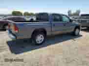 2001 Dodge Dakota Sport z VIN 1B7HL2AX51S296141, wystawiony jako Copart lot #63282445 z przebiegiem 61 567 mil mil oraz Czysty tytuł • Clean title. Historia ofert i sprzedaży dostępna na DreamBid. Obrazek 3.