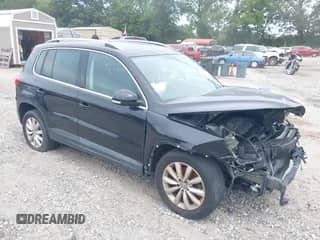 2011 Volkswagen Tiguan SE with VIN WVGAV7AX9BW503208, listed as a IAAI auction lot 40261637 with 131,291 mi miles and . Bid and sale history available at DreamBid. Image 1.