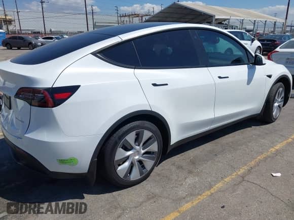 2023 Tesla Model Y Long Range z VIN 7SAYGDEE9PA081036, wystawiony jako IAAI lot #43151161 z przebiegiem 49 637 mil mil oraz . Historia ofert i sprzedaży dostępna na DreamBid. Obrazek 4.