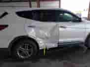 2018 Hyundai Santa Fe 2.4L z VIN 5XYZT3LB5JG516329, wystawiony jako IAAI lot #43392532 z przebiegiem 94 128 mil mil oraz . Historia ofert i sprzedaży dostępna na DreamBid. Obrazek 6.