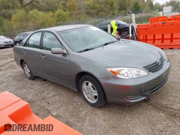 2003 Toyota Camry LE with VIN 4T1BF32K13U553319, listed as a IAAI auction lot 43284776 with 157,210 mi miles and . Bid and sale history available at DreamBid. Image 1.