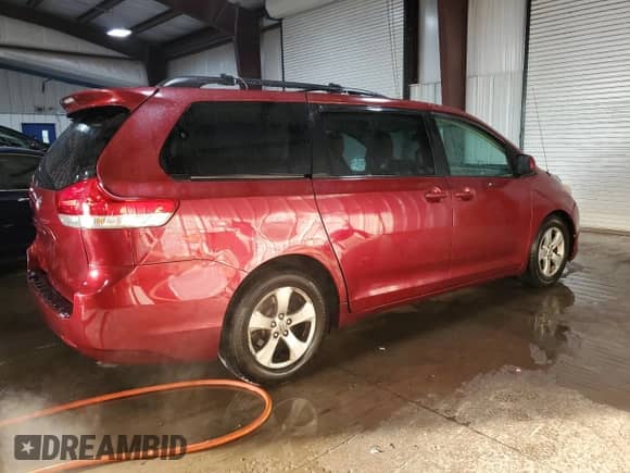 2014 Toyota Sienna LE with VIN 5TDKK3DC6ES518093, listed as a Copart auction lot 85151965 with 104,918 mi miles and Salvage title. Bid and sale history available at DreamBid. Image 3.