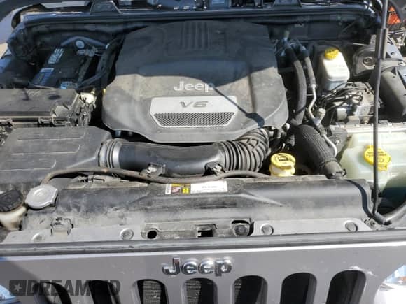 2015 Jeep Wrangler Rubicon Hard Rock z VIN 1C4BJWCG7FL655863, wystawiony jako Copart lot #68092975 z przebiegiem 89 667 mil mil oraz Szkoda całkowita • Salvage title. Historia ofert i sprzedaży dostępna na DreamBid. Obrazek 11.