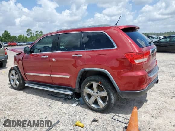 2012 Jeep Grand Cherokee Overland with VIN 1C4RJECG9CC136950, listed as a Copart auction lot 61463225 with 84,983 mi miles and Salvage title. Bid and sale history available at DreamBid. Image 2.