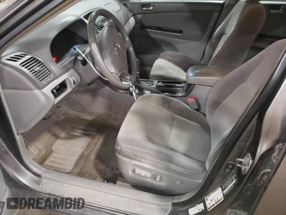 2005 Toyota Camry STD с VIN JTDBE32K853026135, выставлен на аукционе Copart как лот 63873555 с пробегом 206 410 миль миль и Списание • Salvage title. История ставок и продаж доступна на DreamBid. Изображение 7.