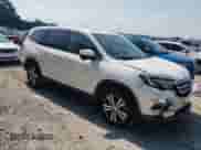 2017 Honda Pilot EX-L with VIN 5FNYF5H56HB046007, listed as a Copart auction lot 80891975 with 134,589 mi miles and Salvage title. Bid and sale history available at DreamBid. Image 4.