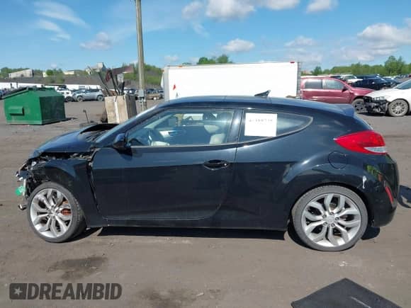 2012 Hyundai Veloster w/Black Int с VIN KMHTC6AD8CU046547, выставлен на аукционе IAAI как лот 42388735 с пробегом 12 884 миль миль и . История ставок и продаж доступна на DreamBid. Изображение 14.