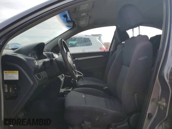 2009 Chevrolet Aveo LS z VIN KL1TD56EX9B341934, wystawiony jako Copart lot #77661564 z przebiegiem 143 614 mil mil oraz Szkoda całkowita • Salvage title. Historia ofert i sprzedaży dostępna na DreamBid. Obrazek 7.