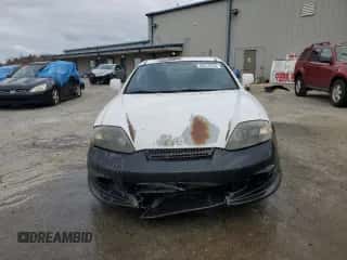 2003 Hyundai Tiburon с VIN KMHHM65D53U042971, выставлен на аукционе Copart как лот 86919434 с пробегом 202 250 миль миль и Списание • Salvage title. История ставок и продаж доступна на DreamBid. Изображение 5.