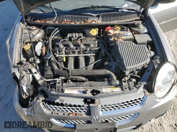 2005 Dodge Neon SXT z VIN 1B3ES56CX5D222609, wystawiony jako Copart lot #79929084 z przebiegiem 169 995 mil mil oraz Szkoda całkowita • Salvage title. Historia ofert i sprzedaży dostępna na DreamBid. Obrazek 11.