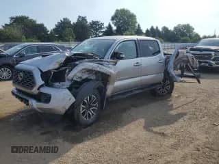 2020 Toyota Tacoma SR5 with VIN 3TMCZ5AN7LM310965, listed as a Copart auction lot 67607825 with 94,465 mi miles and Salvage title. Bid and sale history available at DreamBid. Image 1.