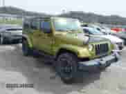 2007 Jeep Wrangler Unlimited Sahara z VIN 1J8GA59167L161894, wystawiony jako IAAI lot #41856064 z przebiegiem 122 714 mil mil oraz . Historia ofert i sprzedaży dostępna na DreamBid. Obrazek 1.