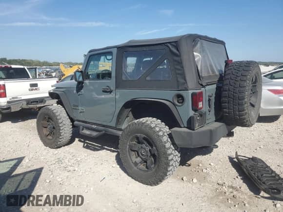 2014 Jeep Wrangler Sport with VIN 1C4AJWAG6EL181224, listed as a Copart auction lot 82060695 with 97,609 mi miles and Clean title. Bid and sale history available at DreamBid. Image 2.