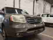 2015 Honda Pilot Touring z VIN 5FNYF4H99FB041247, wystawiony jako IAAI lot #43259358 z przebiegiem 147 500 mil mil oraz . Historia ofert i sprzedaży dostępna na DreamBid. Obrazek 6.