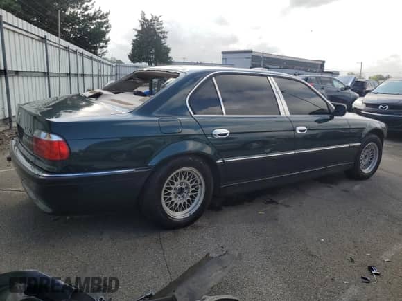 1998 BMW 7 Series 740iL with VIN WBAGJ8329WDM24296, listed as a Copart auction lot 73581634 with 247,498 mi miles and Salvage title. Bid and sale history available at DreamBid. Image 3.