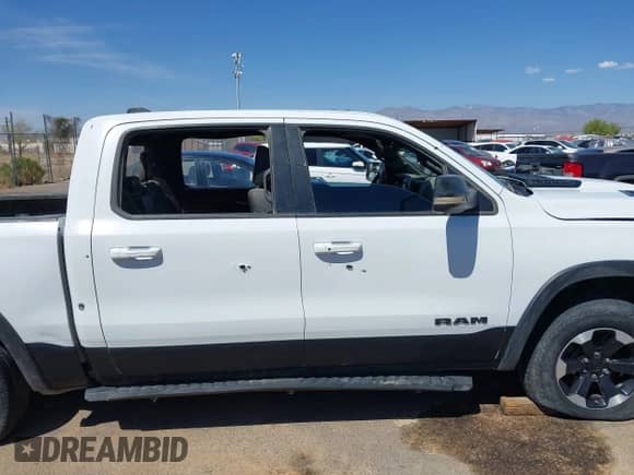 2022 Ram 1500 Rebel z VIN 1C6SRFLT4NN357352, wystawiony jako IAAI lot #41881613 z przebiegiem 31 285 mil mil oraz . Historia ofert i sprzedaży dostępna na DreamBid. Obrazek 12.