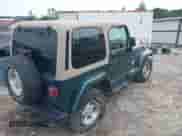 1999 Jeep Wrangler Sahara z VIN 1J4FY49S5XP482037, wystawiony jako IAAI lot #42341723 z przebiegiem 161 081 mil mil oraz . Historia ofert i sprzedaży dostępna na DreamBid. Obrazek 4.