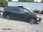 2015 Toyota Sienna SE with VIN 5TDXK3DC8FS650103, listed as a Copart auction lot 60103575 with 124,484 mi miles and Salvage title. Bid and sale history available at DreamBid. Image 4.