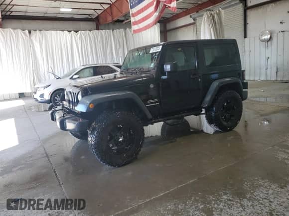 2012 Jeep Wrangler Sport with VIN 1C4AJWAG4CL215593, listed as a Copart auction lot 71013325 with 112,333 mi miles and Salvage title. Bid and sale history available at DreamBid. Image 1.