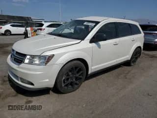 2015 Dodge Journey American Value with VIN 3C4PDCAB3FT699639, listed as a Copart auction lot 64864155 with 117,623 mi miles and Salvage title. Bid and sale history available at DreamBid. Image 1.