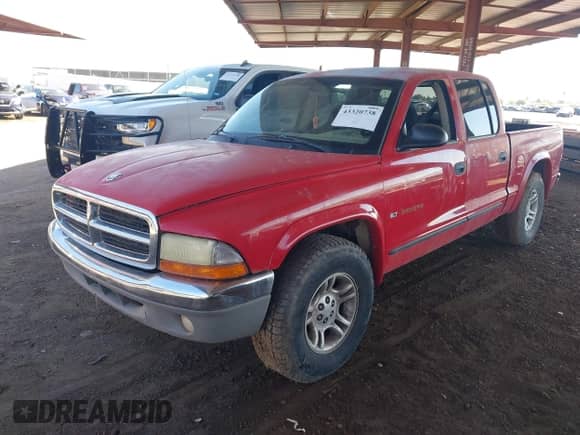 2002 Dodge Dakota SLT with VIN 1B7HL48X72S542335, listed as a IAAI auction lot 43320738 with 239,957 mi miles and . Bid and sale history available at DreamBid. Image 2.
