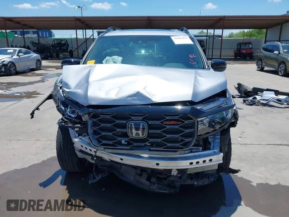 2023 Honda Passport TrailSport z VIN 5FNYF8H66PB044234, wystawiony jako IAAI lot #42462611 z przebiegiem 6 411 mil mil oraz . Historia ofert i sprzedaży dostępna na DreamBid. Obrazek 13.