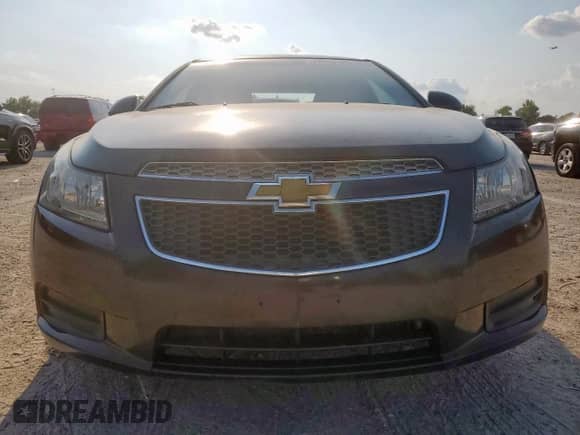 2014 Chevrolet Cruze 1LT z VIN 1G1PC5SB9E7291073, wystawiony jako Copart lot #72093165 z przebiegiem 172 665 mil mil oraz Szkoda całkowita • Salvage title. Historia ofert i sprzedaży dostępna na DreamBid. Obrazek 5.