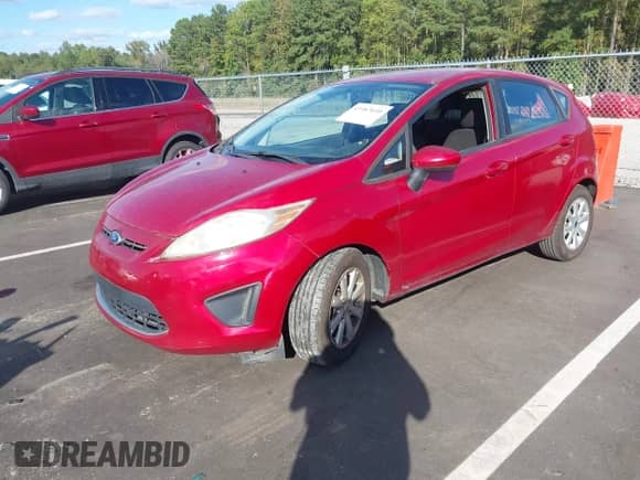 2011 Ford Fiesta SE with VIN 3FADP4EJXBM148068, listed as a IAAI auction lot 43387030 with 154,821 mi miles and . Bid and sale history available at DreamBid. Image 2.