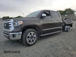 2019 Toyota Tundra SR5 with VIN 5TFAY5F1XKX844714, listed as a Copart auction lot 64446565 with 69,493 mi miles and Salvage title. Bid and sale history available at DreamBid. Image 1.