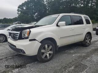 2014 Honda Pilot Touring with VIN 5FNYF4H97EB041584, listed as a Copart auction lot 66761435 with 121,127 mi miles and Salvage title. Bid and sale history available at DreamBid. Image 1.