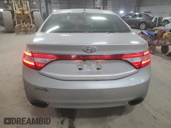 2012 Hyundai Azera с VIN KMHFG4JG2CA183114, выставлен на аукционе Copart как лот 82852674 с пробегом 169 546 миль миль и Списание • Salvage title. История ставок и продаж доступна на DreamBid. Изображение 6.