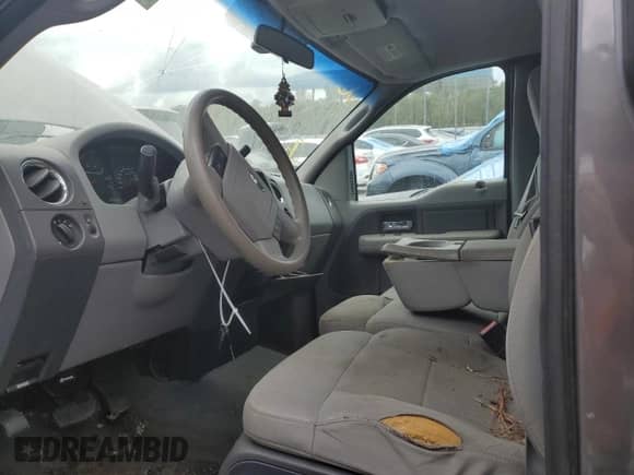 2007 Ford F-150 XL with VIN 1FTRF14V37KC39137, listed as a Copart auction lot 73463164 with 150,331 mi miles and Salvage title. Bid and sale history available at DreamBid. Image 7.