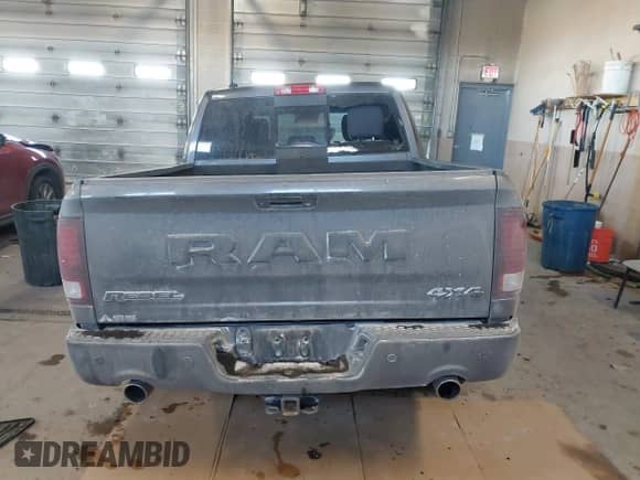 2018 Ram 1500 Rebel with VIN 1C6RR7YT1JS234777, listed as a IAAI auction lot 41409525 with 119,497 mi miles and . Bid and sale history available at DreamBid. Image 16.