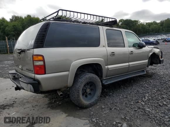 2003 Chevrolet Suburban LT с VIN 3GNGK26G63G310265, выставлен на аукционе Copart как лот 69705495 с пробегом 87 340 миль миль и Списание • Salvage title. История ставок и продаж доступна на DreamBid. Изображение 3.