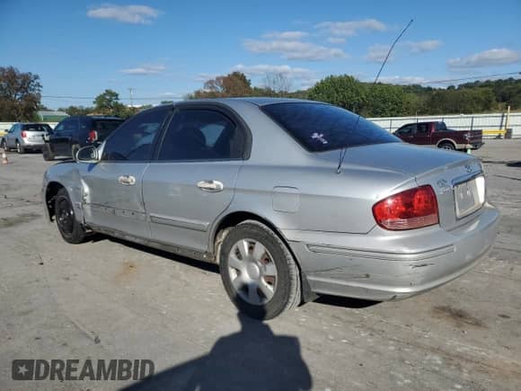 2003 Hyundai Sonata with VIN KMHWF25HX3A868844, listed as a Copart auction lot 81922105 with 513,136 mi miles and Salvage title. Bid and sale history available at DreamBid. Image 2.