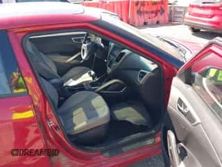 2012 Hyundai Veloster w/Gray Int z VIN KMHTC6AD3CU021409, wystawiony jako IAAI lot #43181633 z przebiegiem 149 988 mil mil oraz . Historia ofert i sprzedaży dostępna na DreamBid. Obrazek 5.