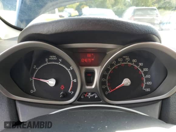 2012 Ford Fiesta SE with VIN 3FADP4BJ4CM114102, listed as a Copart auction lot 81820825 with 104,879 mi miles and Salvage title. Bid and sale history available at DreamBid. Image 9.