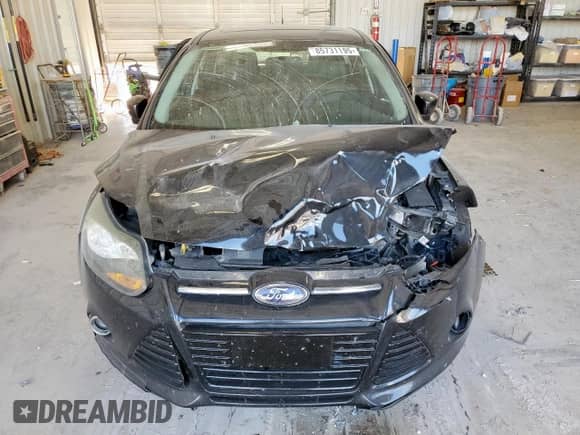 2014 Ford Focus Titanium z VIN 1FADP3N23EL192924, wystawiony jako Copart lot #85731195 z przebiegiem 145 225 mil mil oraz Szkoda całkowita • Salvage title. Historia ofert i sprzedaży dostępna na DreamBid. Obrazek 5.