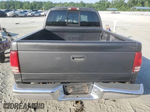 2001 Dodge Dakota Sport with VIN 1B7HL2AX91S334986, listed as a Copart auction lot 61963115 with 261,289 mi miles and Salvage title. Bid and sale history available at DreamBid. Image 6.