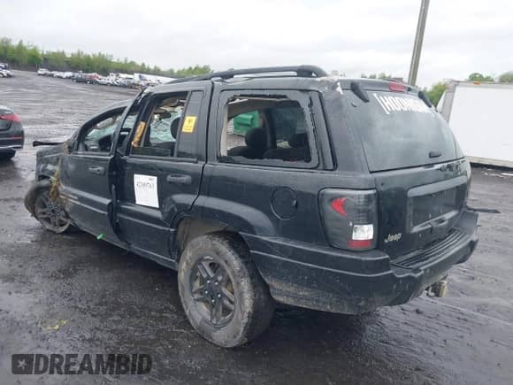 2002 Jeep Grand Cherokee Sport with VIN 1J4GW38SX2C168681, listed as a IAAI auction lot 42309763 with 216,553 mi miles and . Bid and sale history available at DreamBid. Image 3.