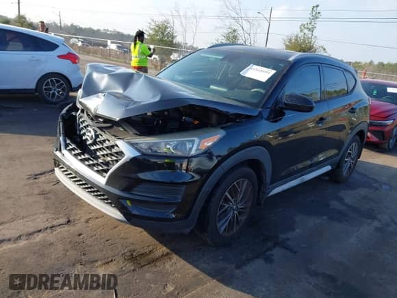 2019 Hyundai Tucson Sport z VIN KM8J33AL9KU878474, wystawiony jako IAAI lot #41568959 z przebiegiem 97 412 mil mil oraz . Historia ofert i sprzedaży dostępna na DreamBid. Obrazek 2.