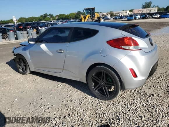 2013 Hyundai Veloster w/Black Int z VIN KMHTC6AD9DU136551, wystawiony jako Copart lot #83799205 z przebiegiem 101 623 mil mil oraz Szkoda całkowita • Salvage title. Historia ofert i sprzedaży dostępna na DreamBid. Obrazek 2.