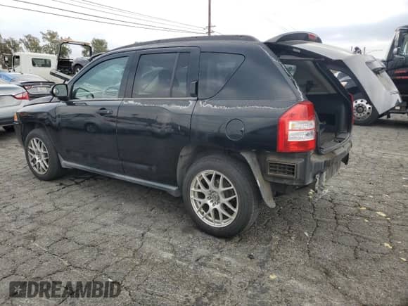 2007 Jeep Compass Sport with VIN 1J8FT47W47D180968, listed as a Copart auction lot 84296085 with 96,757 mi miles and Salvage title. Bid and sale history available at DreamBid. Image 2.