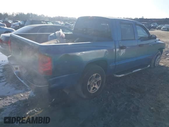 2005 Dodge Dakota SLT с VIN 1D7HE48K35S132981, выставлен на аукционе IAAI как лот 41475748 с пробегом 205 677 миль миль и . История ставок и продаж доступна на DreamBid. Изображение 4.