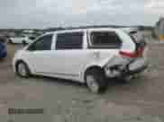 2012 Toyota Sienna XLE with VIN 5TDYK3DCXCS278781, listed as a Copart auction lot 83769325 with 157,885 mi miles and Salvage title. Bid and sale history available at DreamBid. Image 2.
