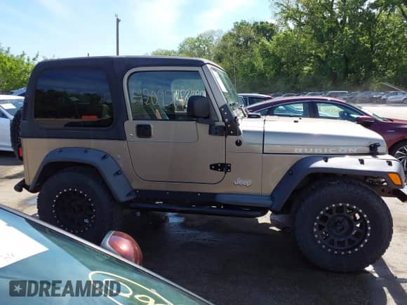 2005 Jeep Wrangler Rubicon z VIN 1J4FA69S35P380944, wystawiony jako IAAI lot #42095879 z przebiegiem 182 176 mil mil oraz . Historia ofert i sprzedaży dostępna na DreamBid. Obrazek 13.