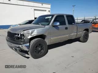 1999 Chevrolet Silverado 1500 LS with VIN 1GCEK19T7XZ143553, listed as a Copart auction lot 68969585 with 215,202 mi miles and Salvage title. Bid and sale history available at DreamBid. Image 1.